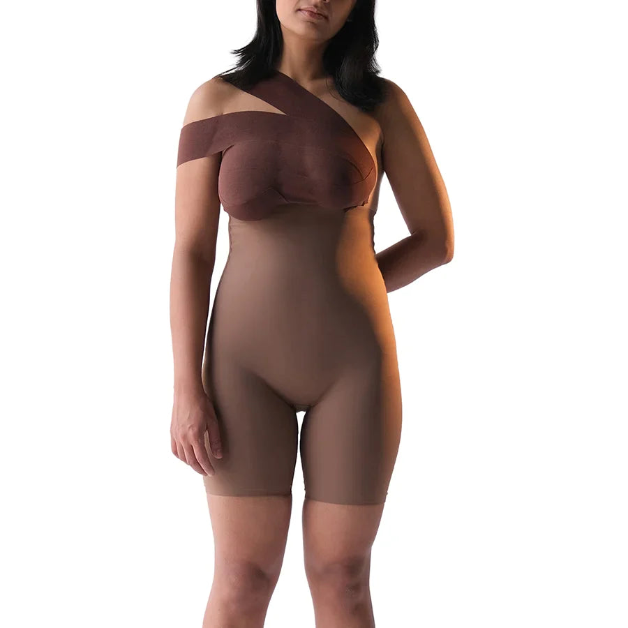 Model wearing "Shorty" shapewear bodysuit in brown tone.