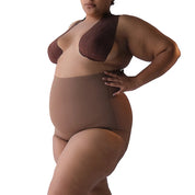 Plus-size model showcasing Super Edge shapewear for enhanced body confidence.