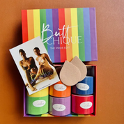 "Butt Chique The Pride Edit bundle with colorful products and promotional card."