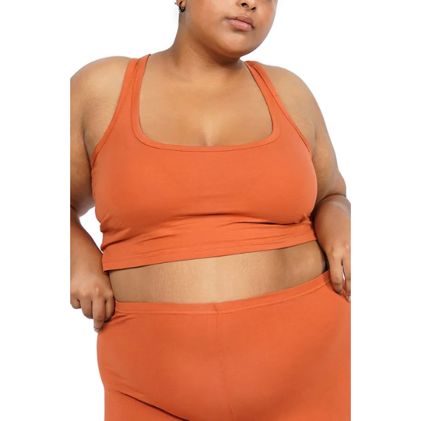 Orange crop racer tank top on a model. Set of 3.