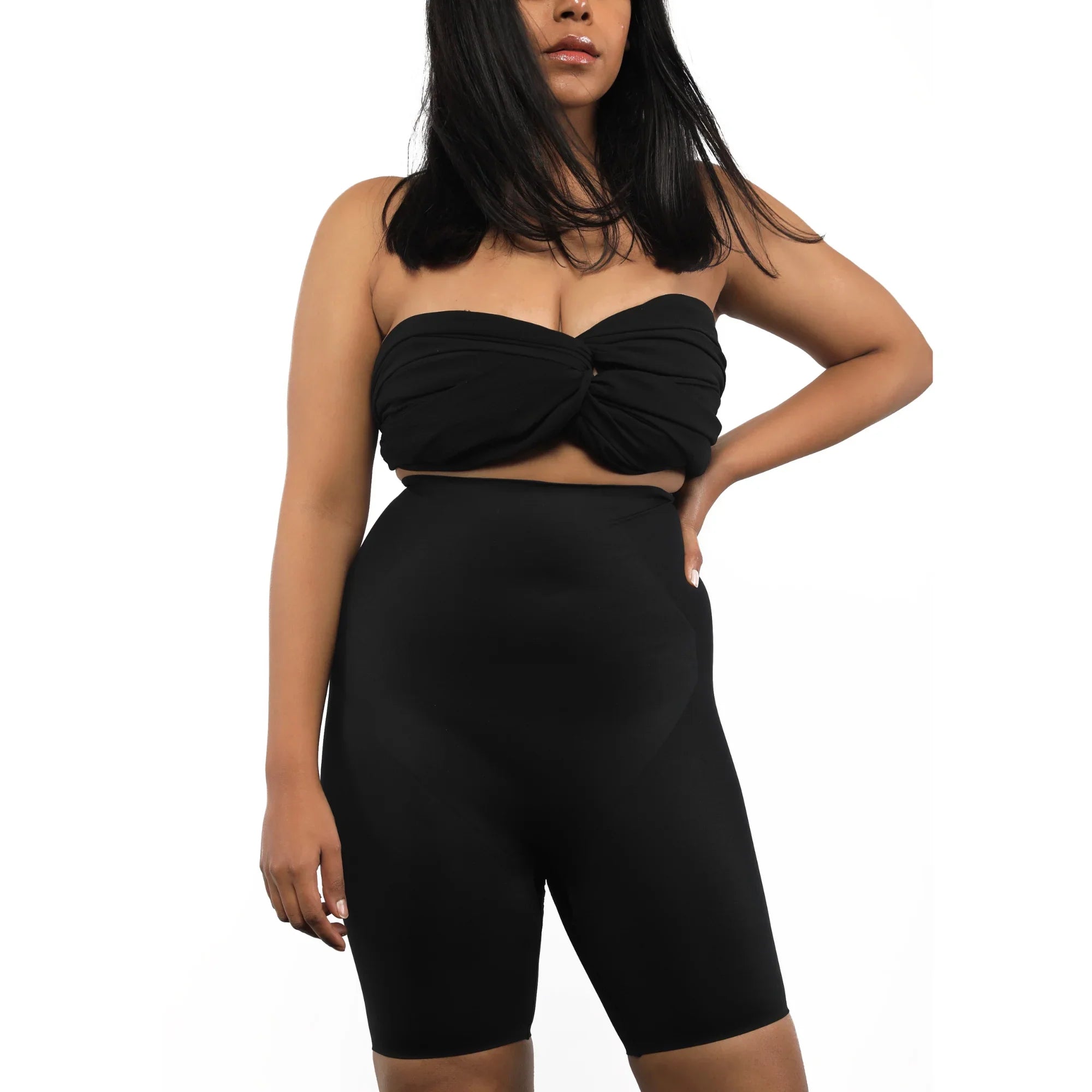 Black high-waist shorts paired with a strapless top.