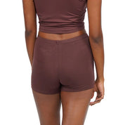 Brown shorts set displayed on a model from the back.