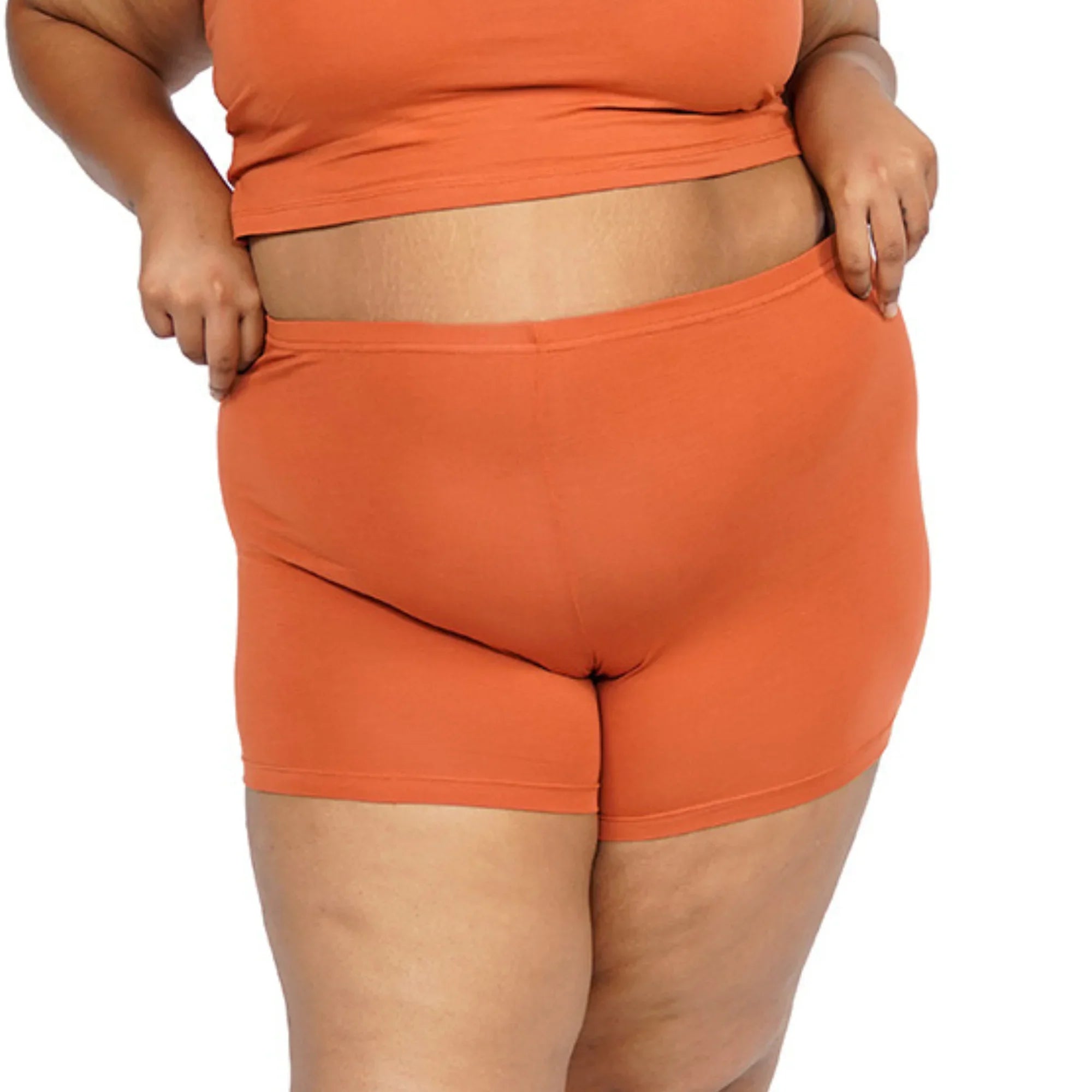 Orange shorts set for women, featuring comfortable stretch fabric.