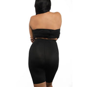 Model wearing black shapewear shorts "Shorty" from the back.